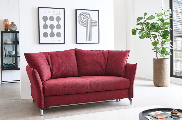 Auffälliges Schlafsofa Lilli in Rot.