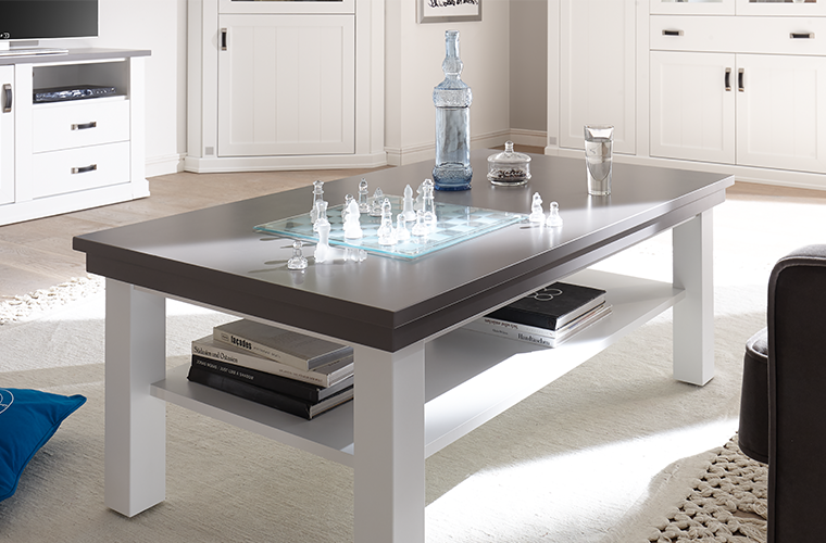 Sylt-Living Couchtisch Art.Nr. 0391 mit grauer Tischplatte und weißem Gestell, inklusive Ablagefach.